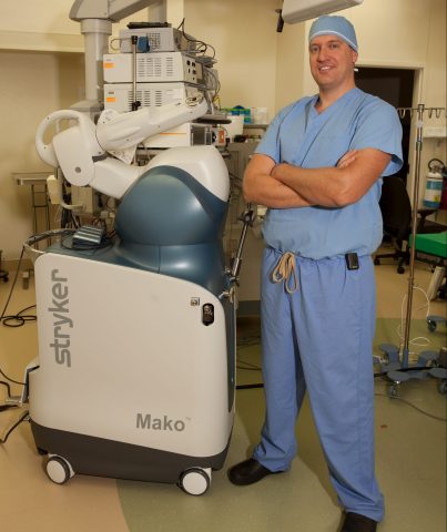 Doctor and robotic arm