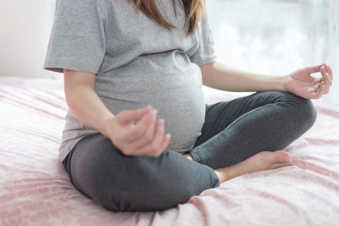 Pregnant woman meditating