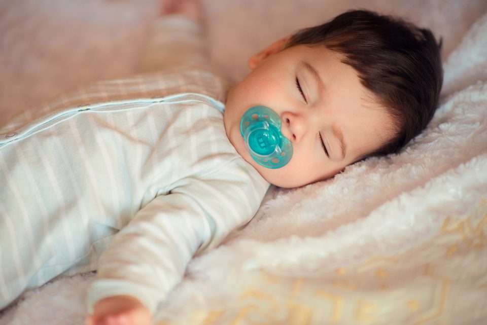 sleeping baby with pacifier