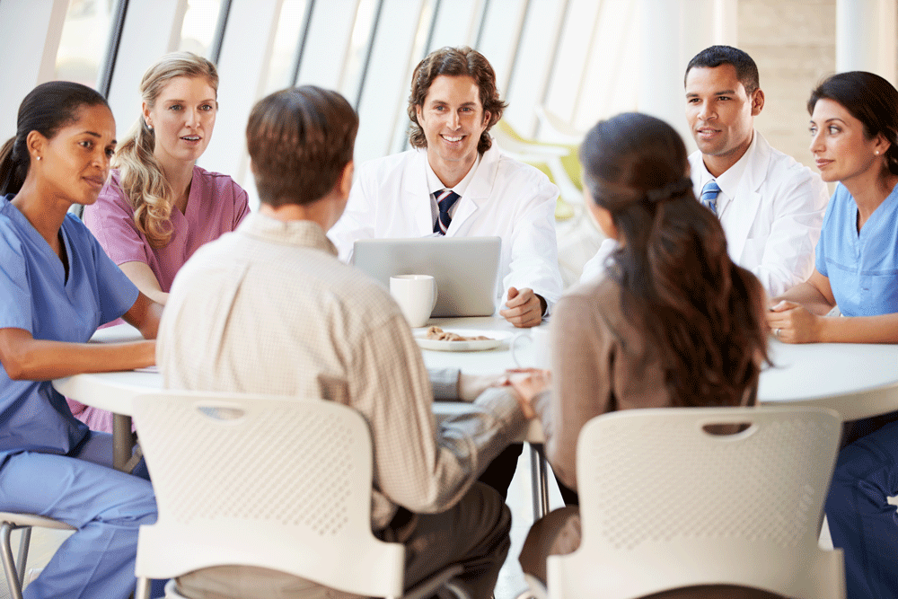 Stock photo of doctors around a table